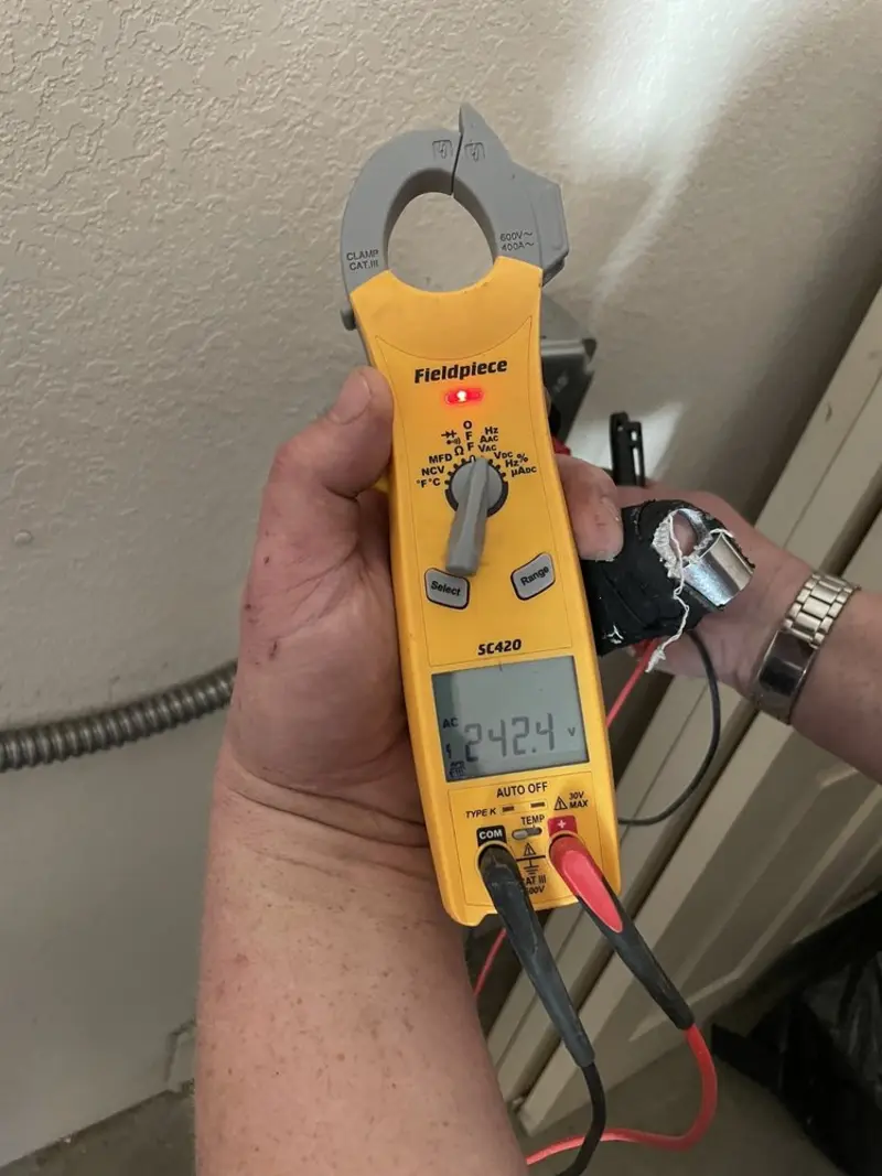 Voltage testing with clamp meter during Circuit Breaker Repair in Snohomish